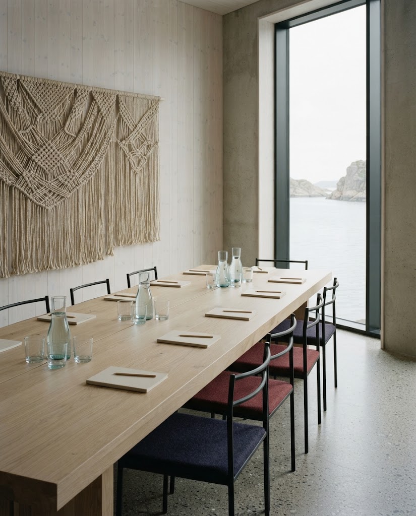 Artist's impression of a meeting room with a long pale wooden table, a knotted wall panel and tall windows onto the sound